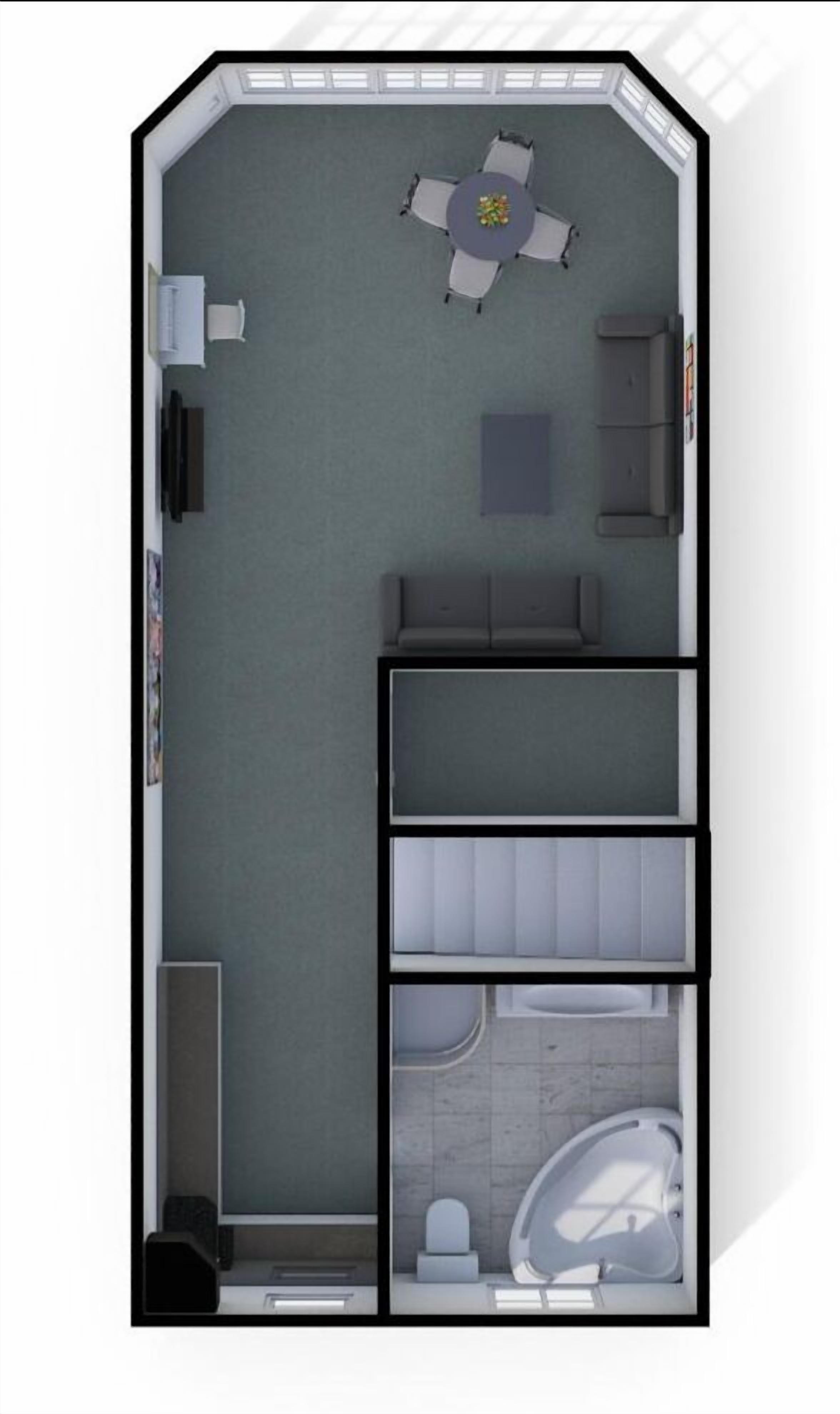 Una habitación con una mesa de comedor, un sofá, un mueble pequeño y un inodoro.