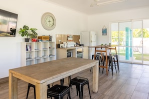 Full-sized fridge, microwave, stovetop, electric kettle