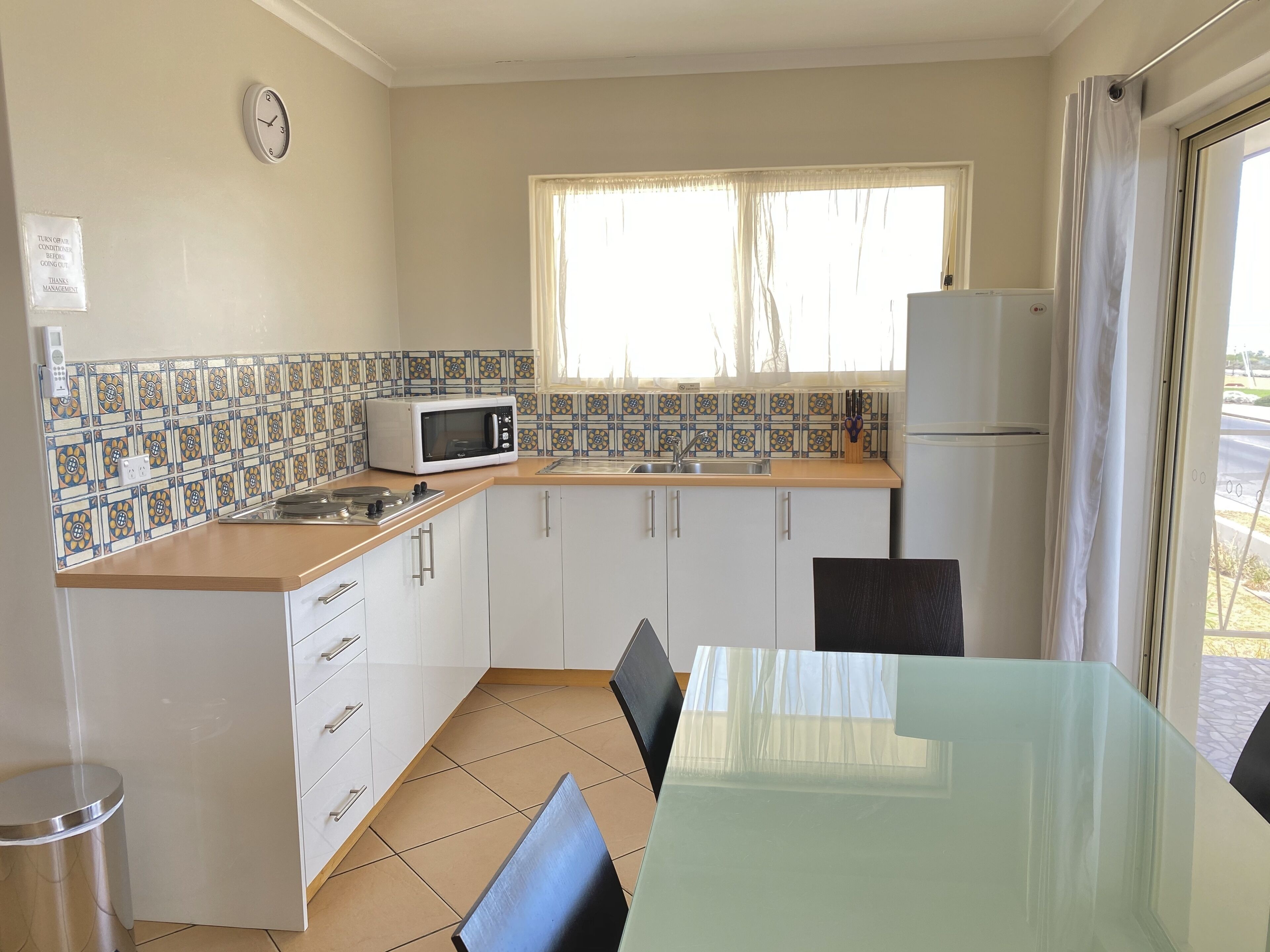 Standard Apartment, 2 Bedrooms, Oceanfront (upstairs) | Private kitchen | Fridge, microwave, stovetop, electric kettle