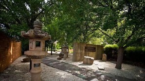 A Japanese war cemetery with stone monuments and a traditional stone lantern. - Cowra Crest Motel (Cowra)
