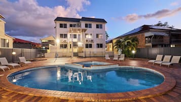 Outdoor pool, open 7:00 AM to 8:00 PM, pool loungers
