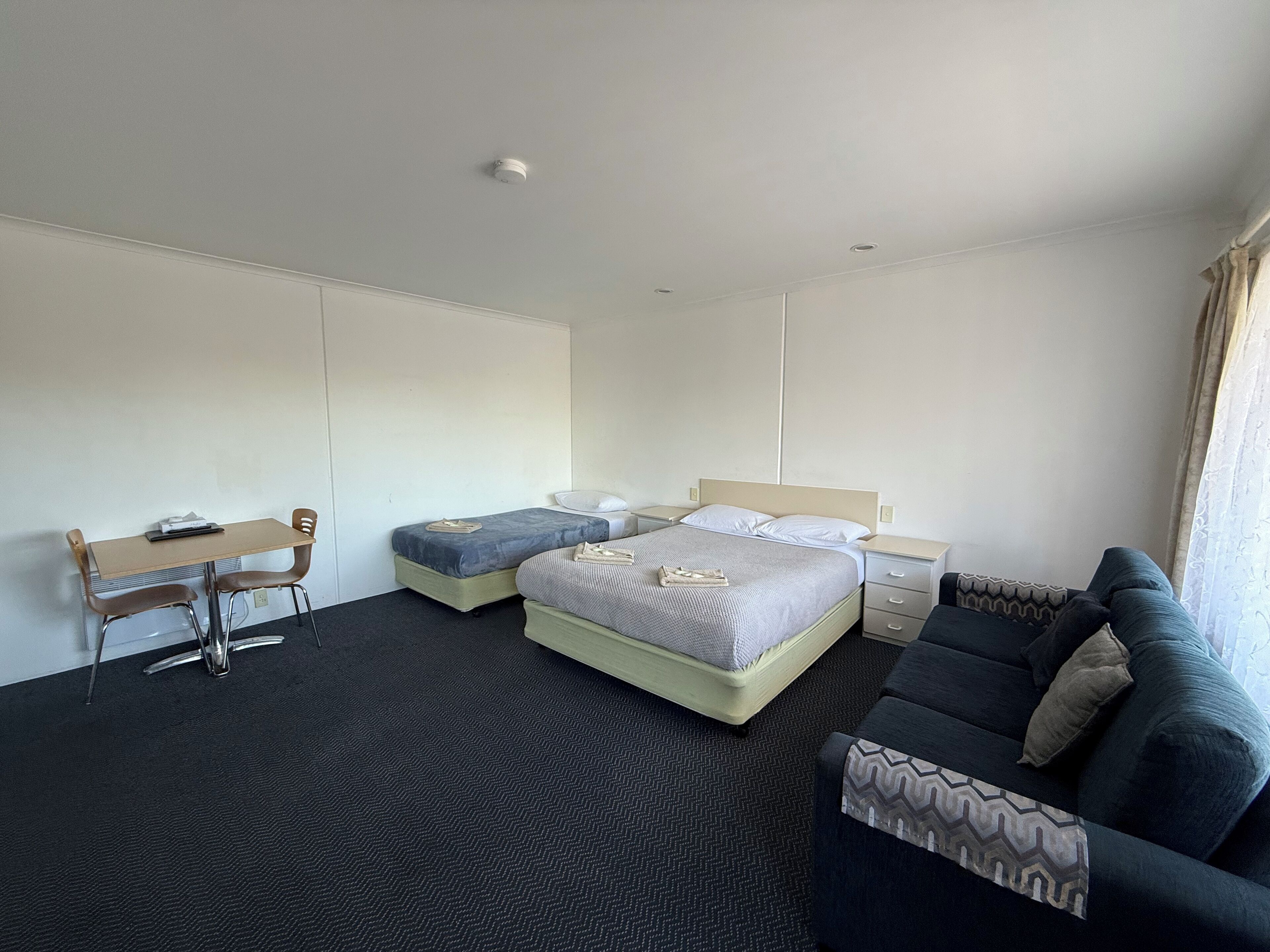 Standard Twin Room, Multiple Beds (Twin Motel Room) | Blackout drapes, iron/ironing board, free WiFi, bed sheets