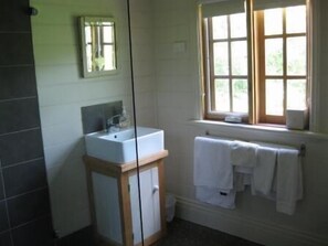 Combined shower/tub, free toiletries, hair dryer, bathrobes