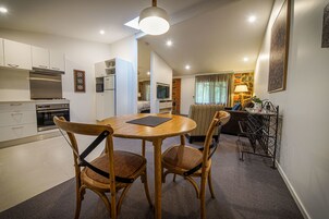 Deluxe Apartment, 1 Queen Bed, Non Smoking, Kitchen (Unit Three s/c) | Living area | Flat-screen TV, DVD player