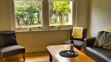 Family Suite, 1 Bedroom, Private Bathroom | Living area | Flat-screen TV