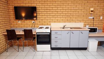 Large Family Room with Balcony (Non Pet Friendly) | Private kitchen | Fridge, microwave, stovetop, coffee/tea maker