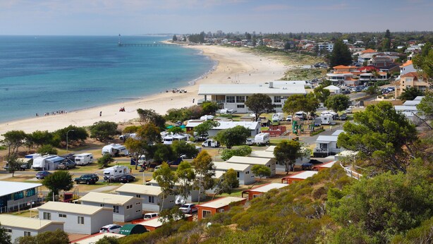 A coastal area with beach access, RV parking, and residential buildings. - Brighton Beachfront Holiday Park (Kingston Park)