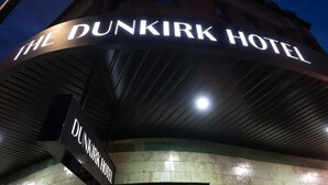 The exterior of The Dunkirk Hotel with its illuminated signage. - The Dunkirk Hotel (Pyrmont)