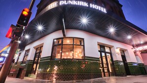 The Dunkirk Hotel with a curved facade, large windows, and a green-tiled entrance. - The Dunkirk Hotel (Pyrmont)