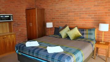 Standard King Room | Blackout curtains, iron/ironing board, bed sheets