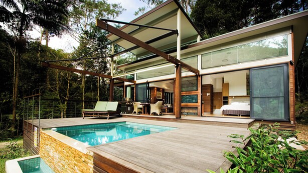 A modern house with a swimming pool, wooden deck, and large glass windows. - Crystal Creek Rainforest Retreat (Upper Crystal Creek)