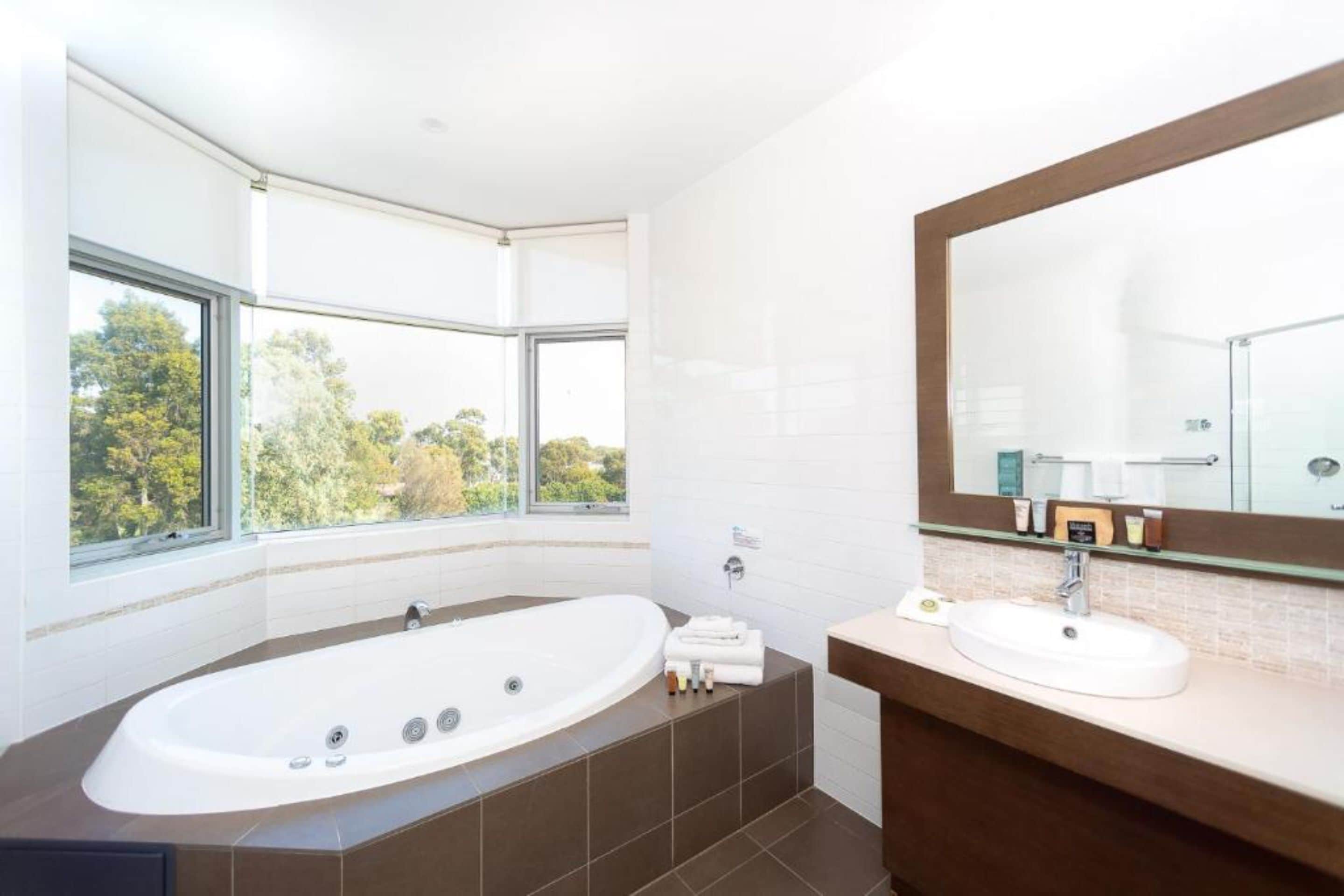 deluxe spa suite with balcony | bathroom | free toiletries, hair dryer, towels, soap