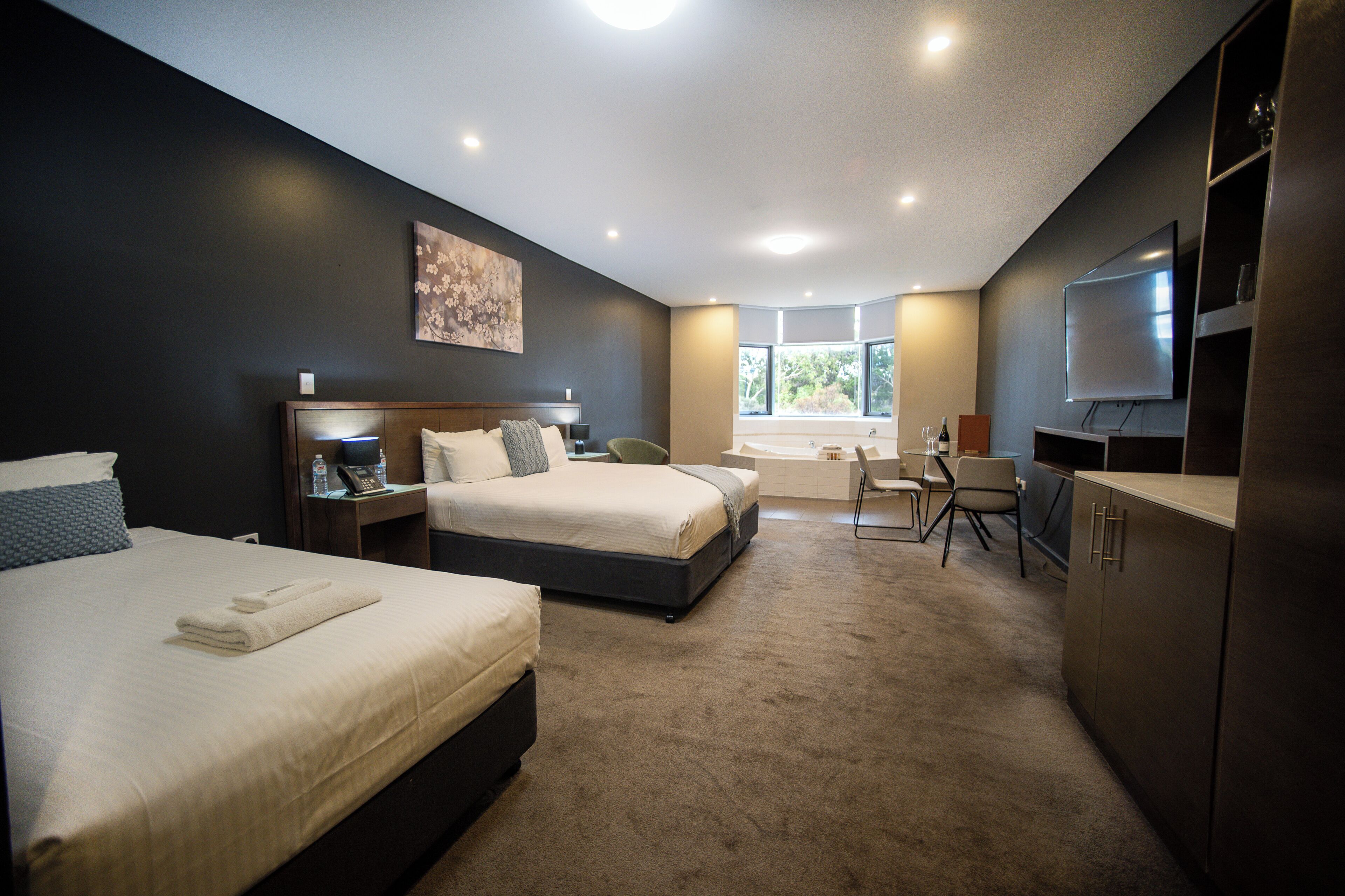 Deluxe suite (Deluxe Spa Suite) | Een minibar, een bureau, verduisterende gordijnen