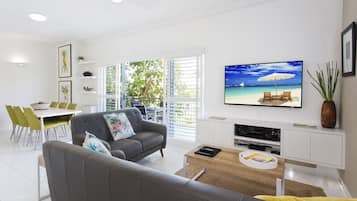 Deluxe Apartment, 2 Bedrooms | Living area | 40-inch flat-screen TV with digital channels, TV, DVD player