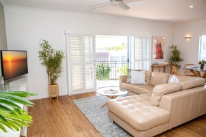 1 Bedroom Deluxe Apartment | Living area | 40-inch flat-screen TV with digital channels, TV, DVD player