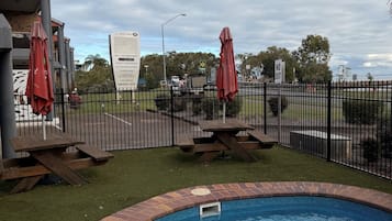 Outdoor pool, open 9:00 AM to 7:00 PM, pool umbrellas, sun loungers