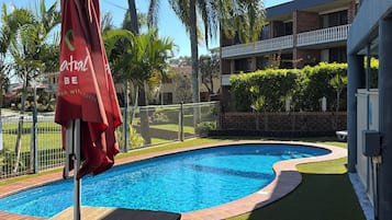 Outdoor pool, open 9:00 AM to 7:00 PM, pool umbrellas, pool loungers