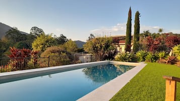 Outdoor pool, open 6:00 AM to 9:00 PM, pool umbrellas