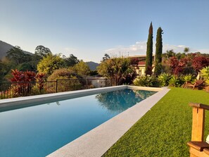 Outdoor pool, open 6:00 AM to 9:00 PM, pool umbrellas