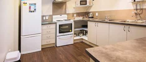 Family Apartment, 3 Bedrooms | Private kitchen | Fridge, microwave, electric kettle, cookware/dishes/utensils