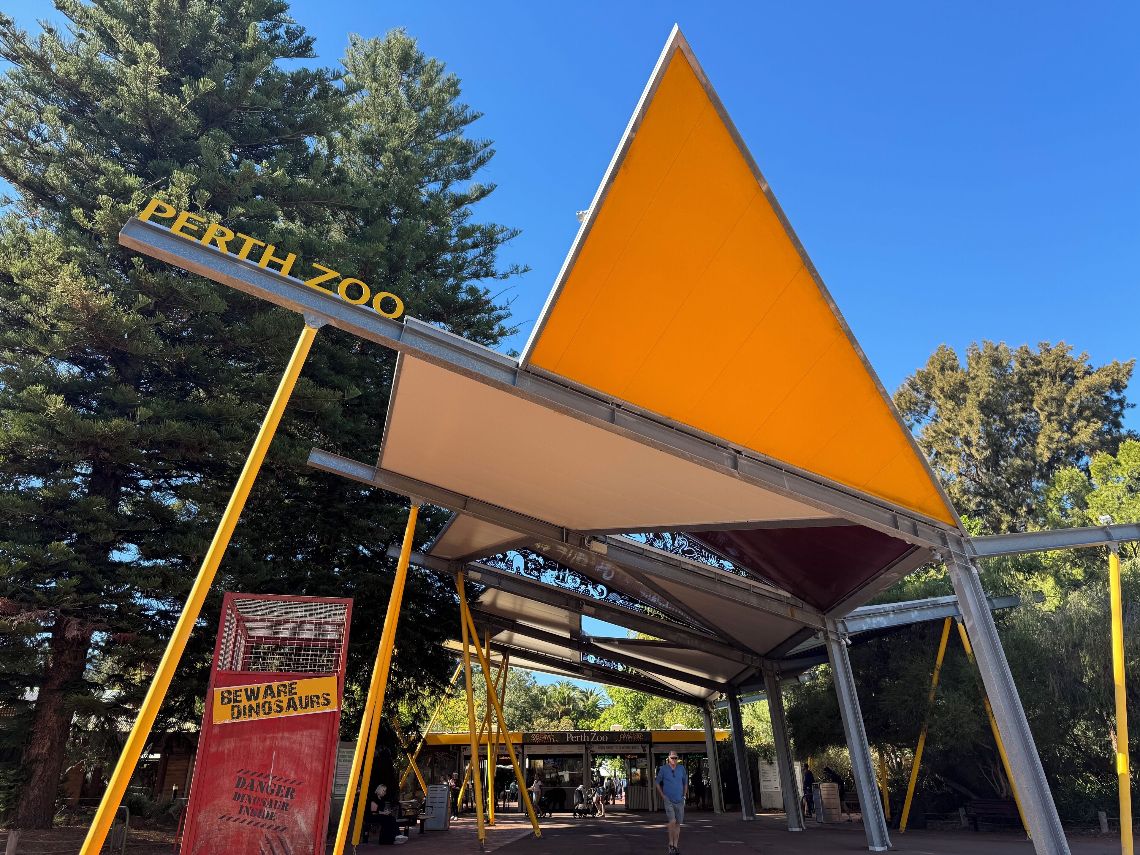 A structure with a triangular roof and a sign that reads "PERTH ZOO".