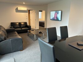 Apartment, 2 Bedrooms | Living area | 43-inch flat-screen TV with satellite channels, TV, Netflix