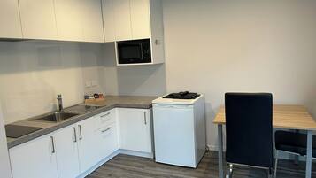 Apartment, 1 Bedroom | Private kitchen | Fridge, microwave, stovetop, coffee/tea maker