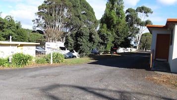 Stroll down this quiet, tree-lined street lined with single-story buildings.