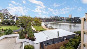 A residential area with a river, modern buildings, and a park with a gazebo. - Bridgewater Terraces (Kangaroo Point)