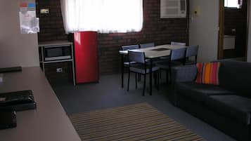 Family Room, Multiple Beds, Non Smoking, Kitchenette | Living area | Flat-screen TV, DVD player, pay movies