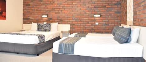 Family Room | Down comforters, free minibar, individually furnished, desk