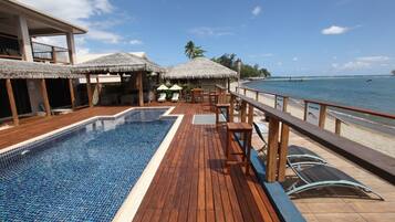 Outdoor pool, open 9:00 AM to 7:00 PM, pool loungers