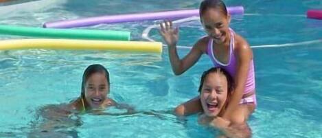 Outdoor pool, open 9 AM to 8 PM, pool loungers