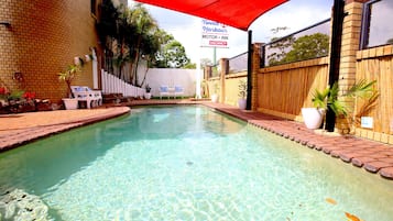 Outdoor pool, open 7:00 AM to 8:00 PM, pool umbrellas, pool loungers