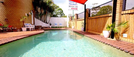 Outdoor pool, open 7:00 AM to 8:00 PM, pool umbrellas, pool loungers
