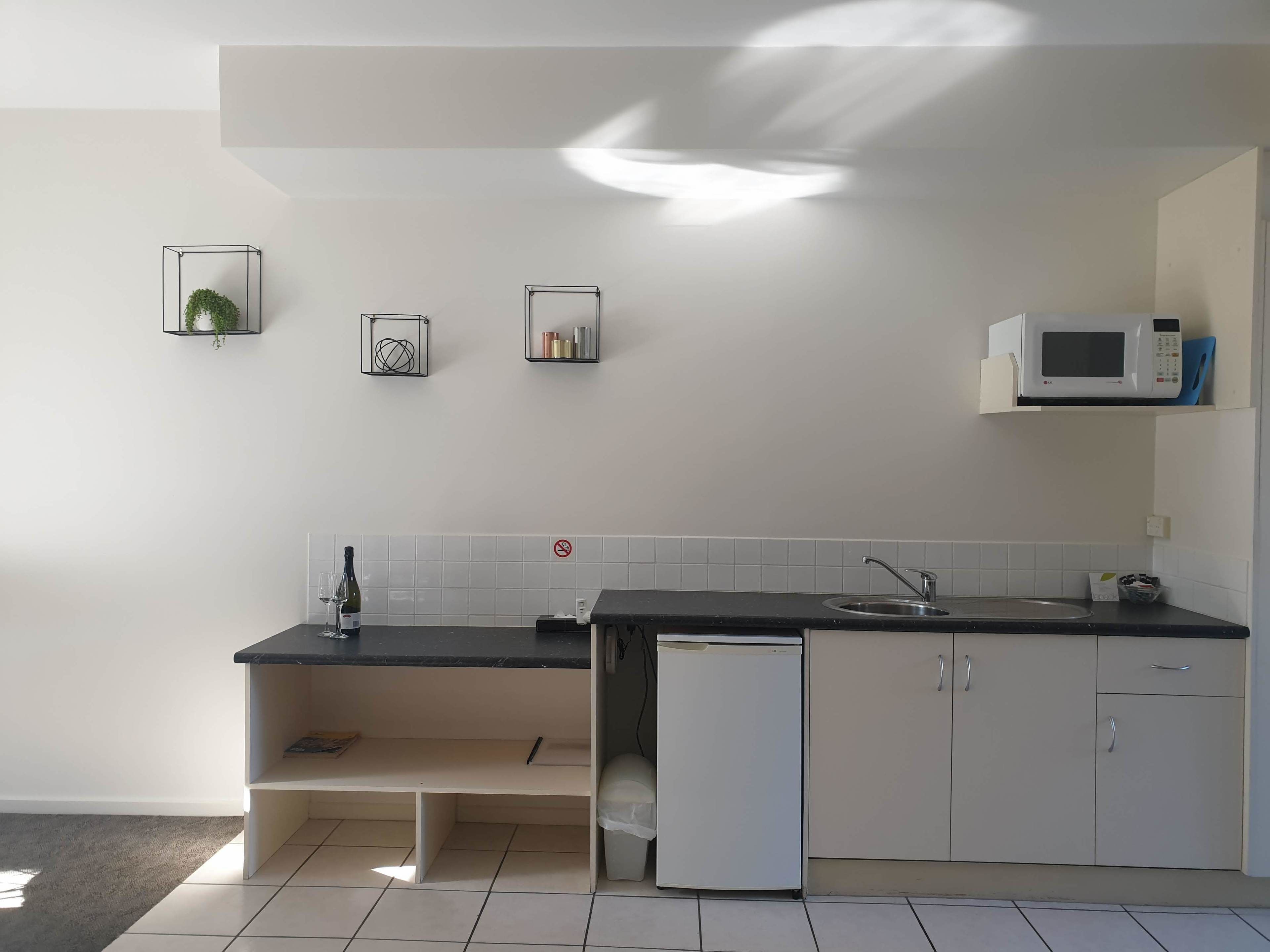 microwave, coffee/tea maker, cookware/dishes/utensils