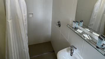 Shower, free toiletries, towels, soap