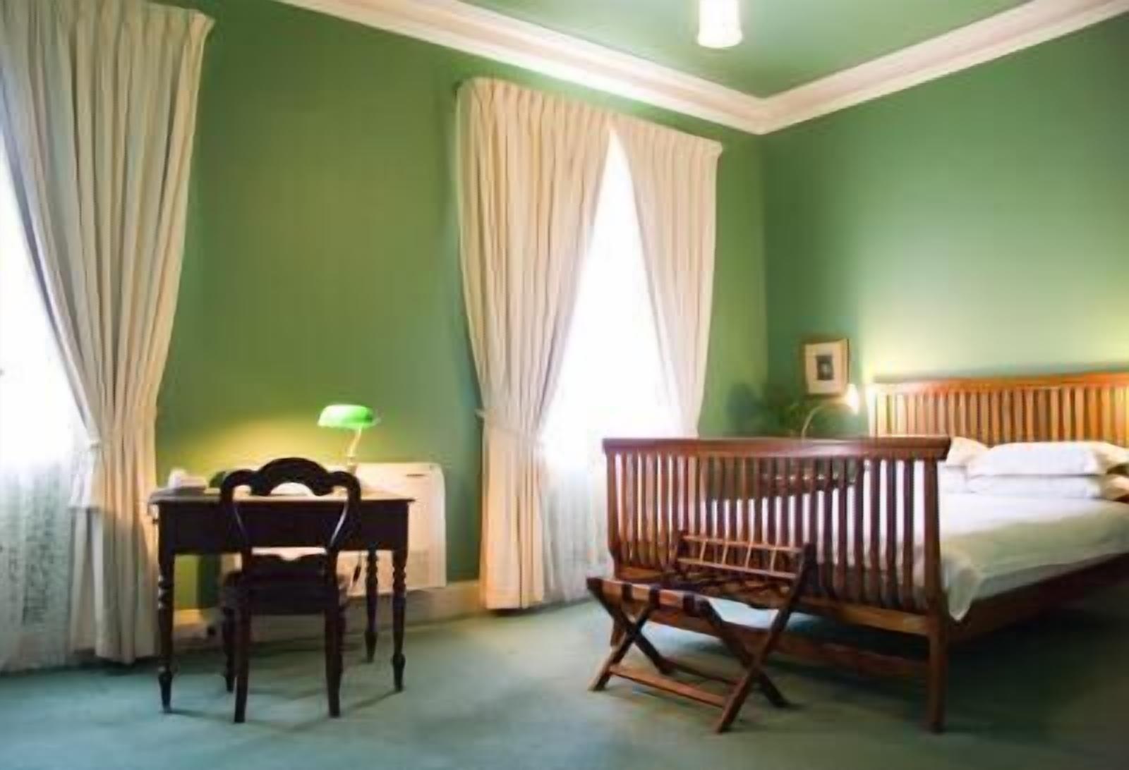 superior queen ensuite room | premium bedding, desk, iron/ironing board