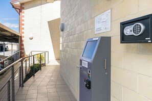 A 24-hour check-in kiosk at a hotel and motel. - Queensport Hotel (Brisbane)