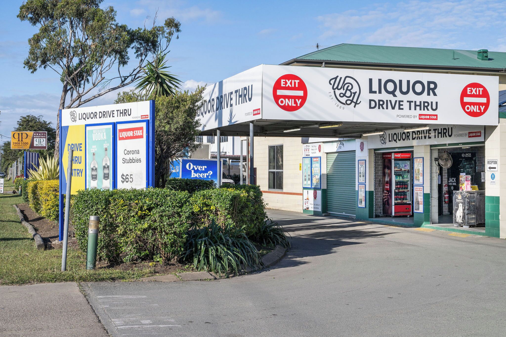 A Liquor Drive Thru with a sign indicating it's an exit only lane.