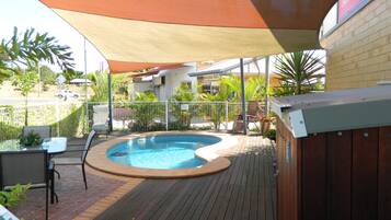 Outdoor pool, open 7:00 AM to 9:00 PM, pool loungers