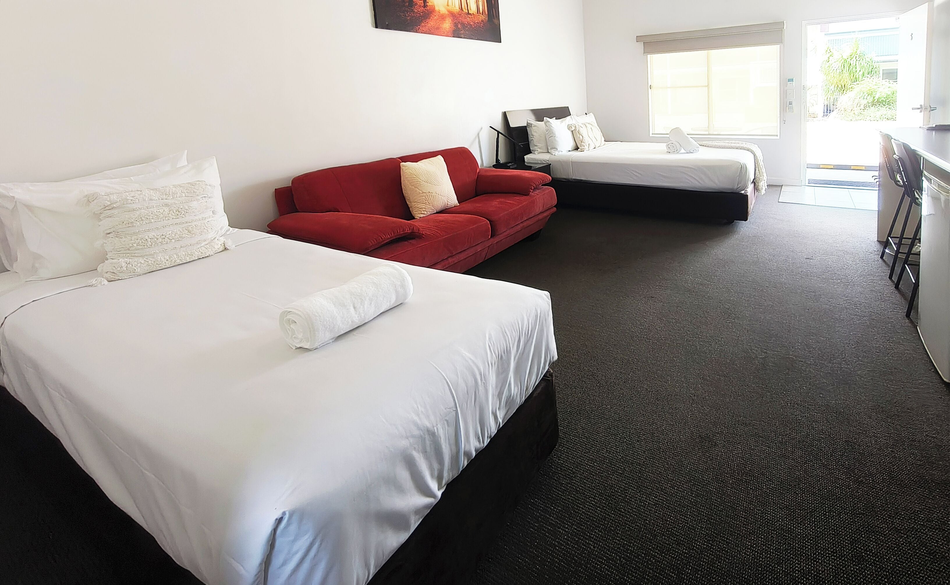 Deluxe Room, Non Smoking (Deluxe Queen and Single) | Desk, laptop workspace, iron/ironing board, free WiFi