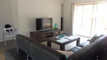 Executive Apartment, 2 Bedrooms, Non Smoking, Kitchen (Executive spa apartment) | Living area | 50-inch TV with digital channels, Netflix, DVD player