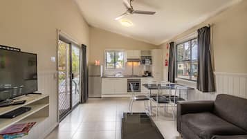 Deluxe Two Bedroom Cabin | Living area | TV