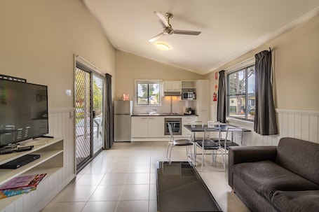 Deluxe Two Bedroom Cabin | Living area | TV