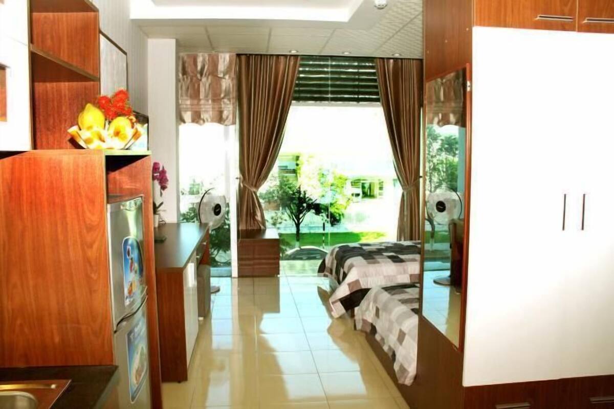 Apartamento, vista para a cidade | Área de estar | TV LCD 32 polegadas com canais a cabo, TV