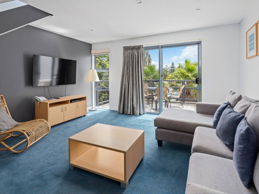 Two Bedroom Apartment with Pool View (Steep Internal Stairs) | Living area | 36-inch LCD TV with digital channels, TV