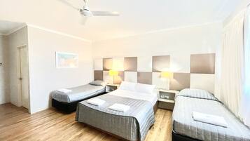 Family Room, Multiple Beds | Blackout curtains, iron/ironing board, free WiFi, bed sheets