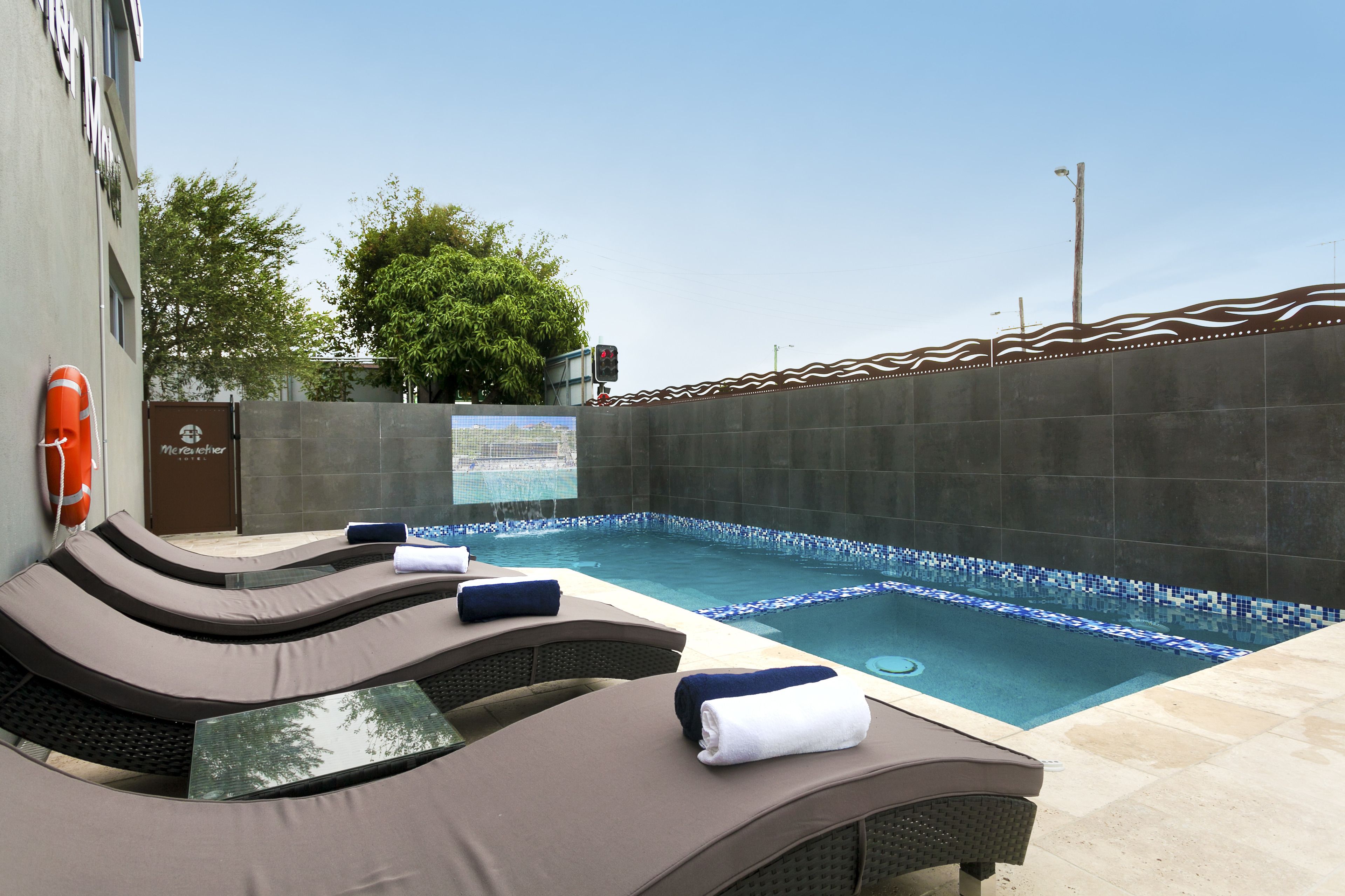 Outdoor pool, open 7:00 AM to 8:00 PM, pool loungers