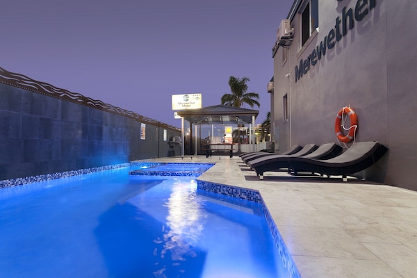 Outdoor pool, open 7:00 AM to 8:00 PM, pool loungers